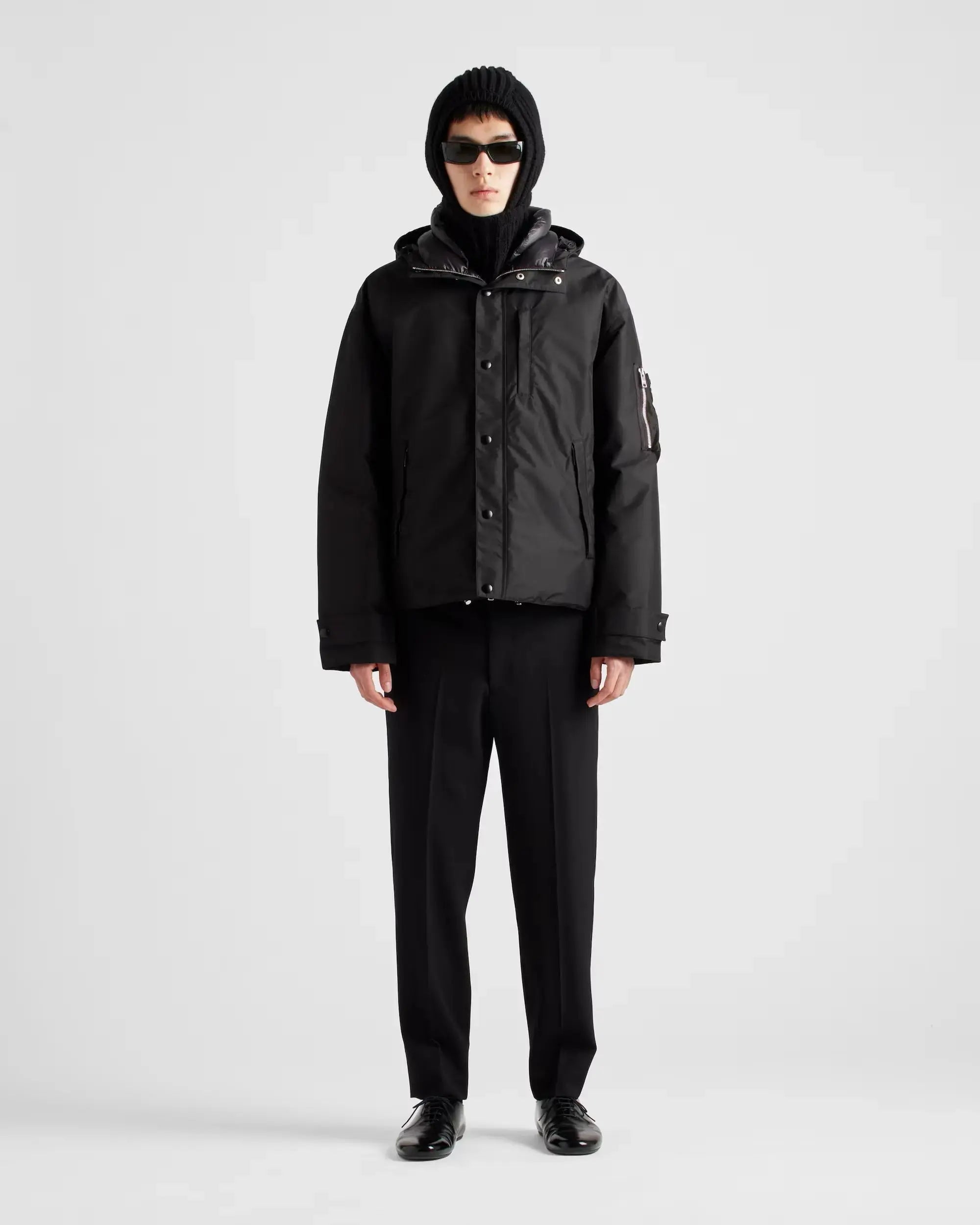 Doudoune à capuche en tissu technique Prada