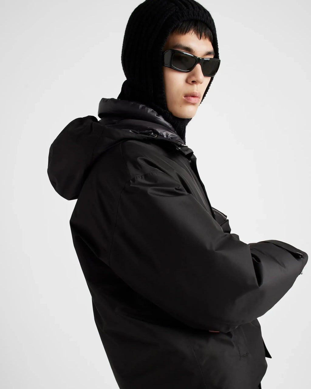 Doudoune à capuche en tissu technique Prada